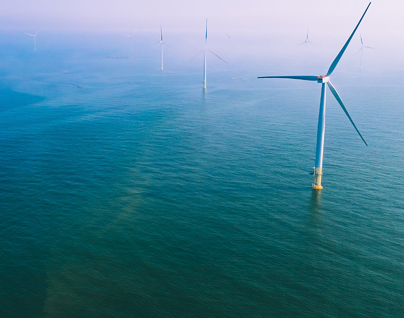 Wind turbine. Aerial view of wind turbines or windmills farm fie